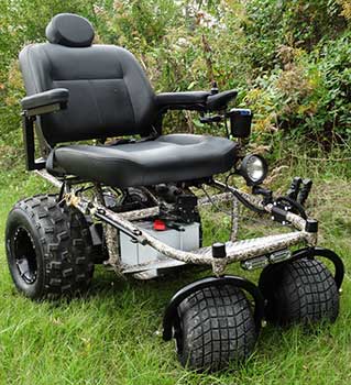 Outdoor Extreme Mobility Nomad All Terrain Power Wheelchair on green grass