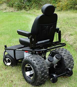 Back View of the Outdoor Extreme Mobility Nomad All Terrain Power Wheelchair on green grass
