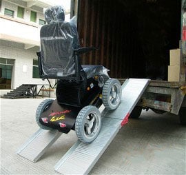 A Viking 4x4 Wheelchair being loaded into a full-sized truck through a ramp