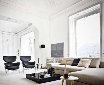 Franco Albini's 836 Tre Pezzi Armchair Upholstered With Black Fabric in a contemporary Living Room