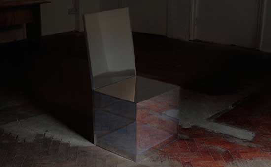 Side view of the Affinity Chair, a mirror-like chair reflecting its surroundings to appear invisible