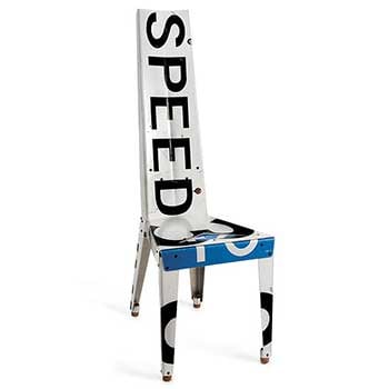 A chair made of blue and white road signs, with the word "speed" printed on the backrest