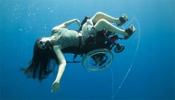 Image of Sue Austin underwater with her Submersible Wheelchair