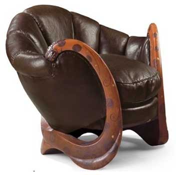 An image of Eileen Gray's Dragons Armchair decorated with spiraling wooden armrests and shell-shaped dark brown backrest