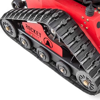 Tracks of the red Rocket Mobility Tomahawk All-Terrain Wheelchair