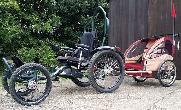 Bobcat trailer attached to the Boma 7 All terrain wheelchair