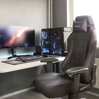 An image of Devoko Ergonomic Gaming Chair in a Gaming Enviroment in deep black color
