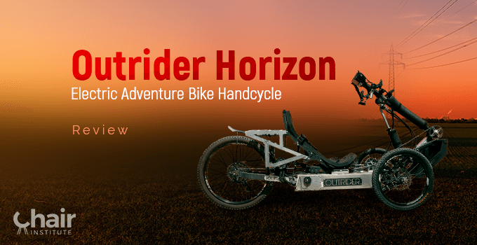The Outrider Horizon Electric Adventure Bike Handcycle in a grassy outdoor with electric lines in the background