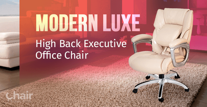 The Modern Luxe High Back Executive Office Chair on a carpet with a couch in the opposite side