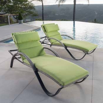 Two Ginkgo Green RST Cannes Chaise Lounge setup on poolside in nature.