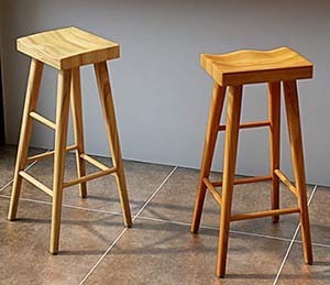 Two YE ZI solid wood bar stool on a wooden floor 