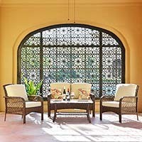Full set of the Ovios 4 Piece Rattan Outdoor Furniture set with beige cushions