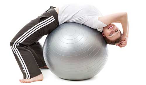 A Girl is doing Exercise on Exercise Ball