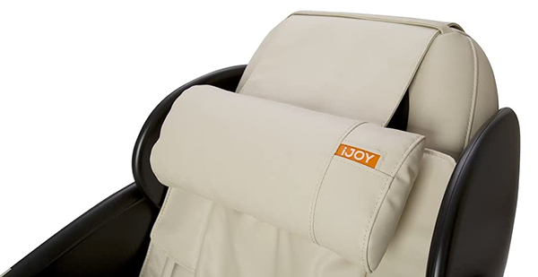 iJoy Total with beige SofHyde upholstery, black exterior, and a neck cushion with the model name "iJoy" in white and orange