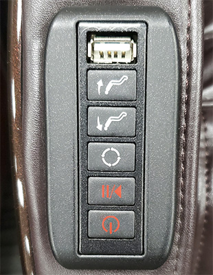 Kahuna HM 5000 Massage Chair's basic controls built into one of the arms, with USB port, power button, and other controls