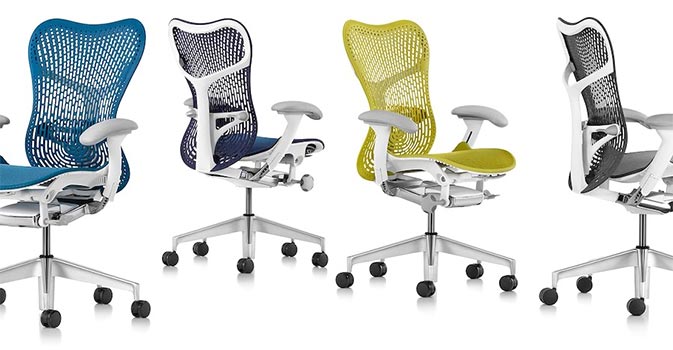 Mirra 2 chairs with studio white frames and in four colors — dark turquoise,, twilight blue, lime green, and slate gray 