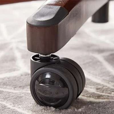 La-Z-Boy Delano black caster wheel over a brown and beige carpet