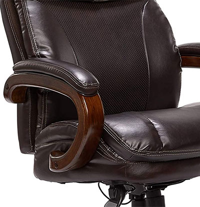 Trafford Chair dark brown variant with padded armrests, stained wood frame, and thick cushion for the seat and seatback