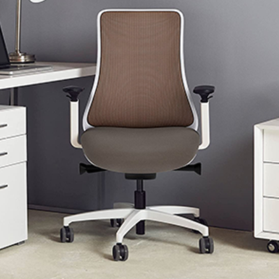 Via Genie Task Chair with natural copper mesh seatback, white frame, and gray fabric seat in an office with white furniture